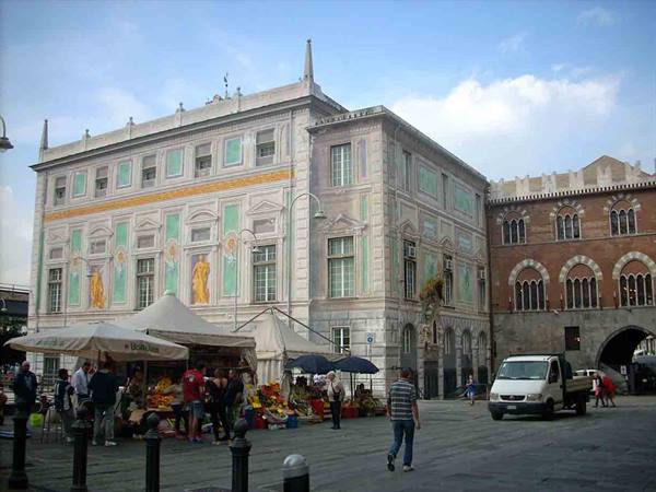 Palazzo San Giorgio in Genoa, market stalls under tents in Piazza Caricamento