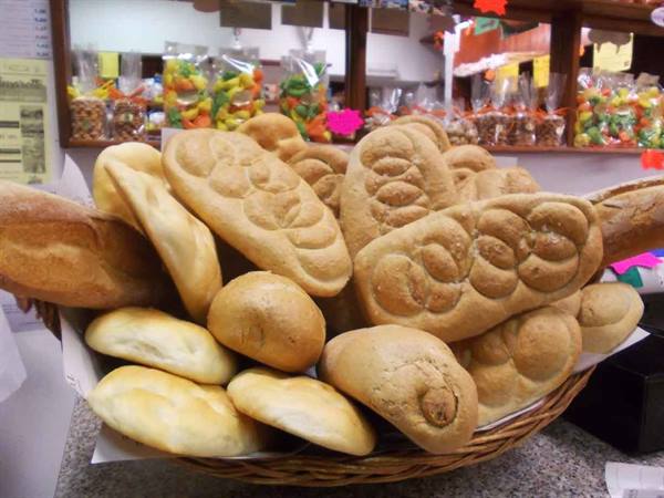 Wicker basket full of fresh bread at a bakery