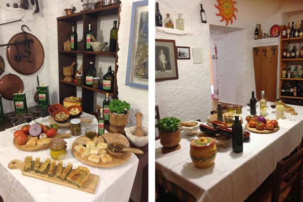 Table set with focaccia, tomatoes and olive oil in a rustic kitchen