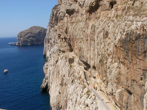 Footpath carved into the cliff above the sea at Masua, near Pan di Zucchero