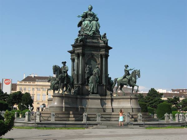 Woman photographs the bronze Maria Theresa monument in Vienna