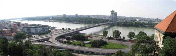 UFO Bridge over the Danube in Bratislava, traffic ramps and red rooftops