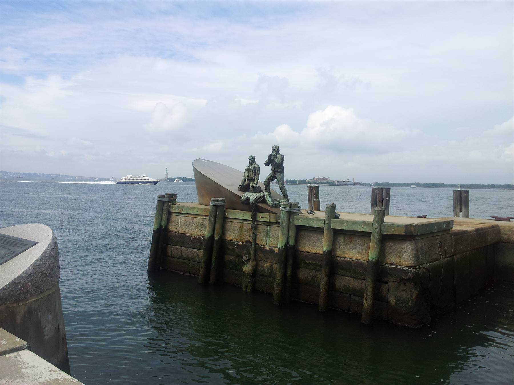 Merchant Mariners' Memorial at Battery Park, New York, with ferry in the harbor