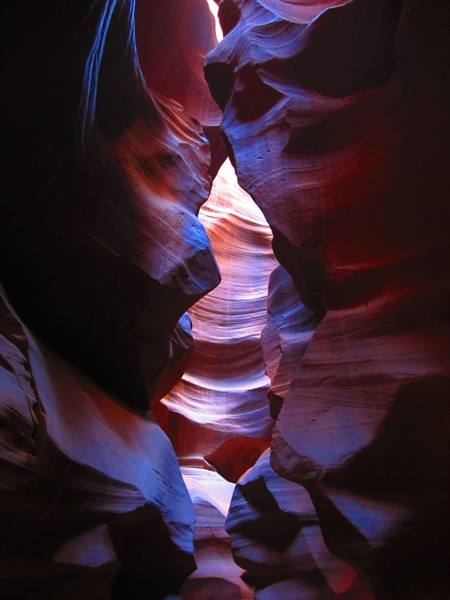 Light on wavy red sandstone walls in Antelope Canyon