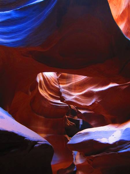 Antelope Canyon: carved sandstone walls, light streaming through narrow gaps