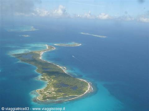 Los Roques island from the plane, white sand, turquoise lagoons in blue sea