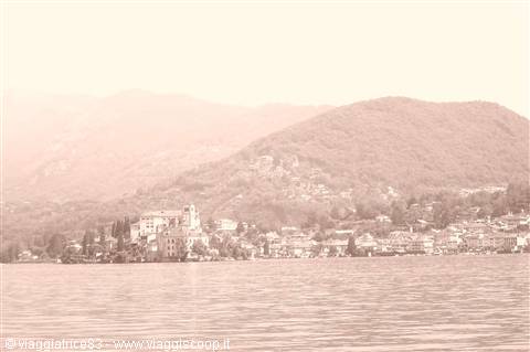 Lake Orta, San Giulio Island village surrounded by hills and calm water