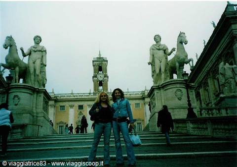 Two girls on the Campidoglio steps among the Dioscuri statues in Rome