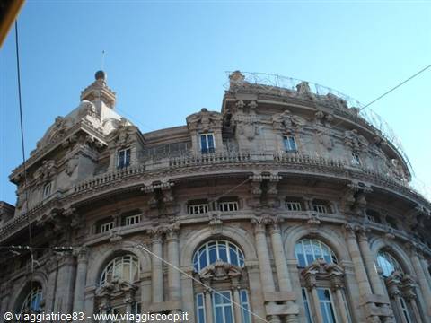 Ornate stone liberty-style building with statues and dome, Genoa