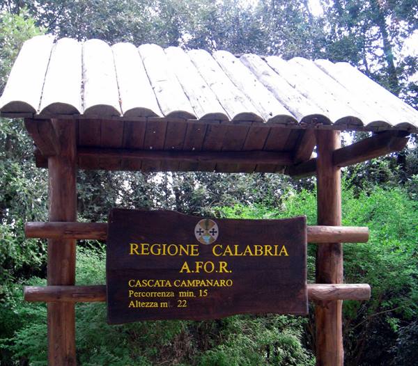Wooden sign marks Cascata Campanaro, 22 meters high, among green trees