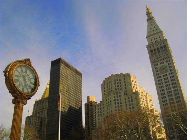 Cast-iron clock in Madison Square with Metropolitan Life tower in New York