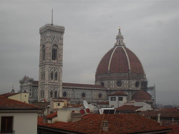 Florence Cathedral with Brunelleschi's dome and Giotto's bell tower above the rooftops