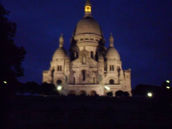 Sacré-Cœur basilica illuminated at night in Montmartre, Paris