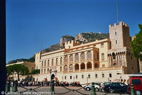 Prince's Palace of Monaco, yellow facade with medieval tower under blue sky