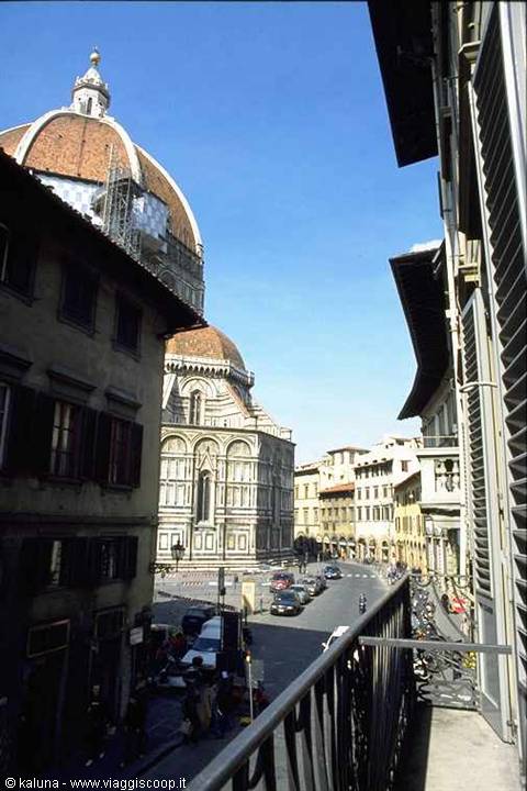 From a balcony, Florence Cathedral dome rises above the rooftops