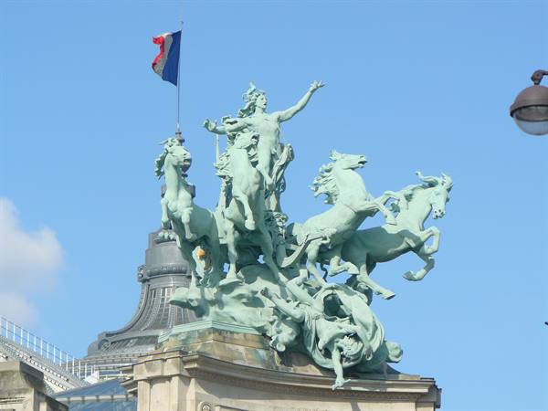 Bronze quadriga with rearing horses and French flag atop the Grand Palais