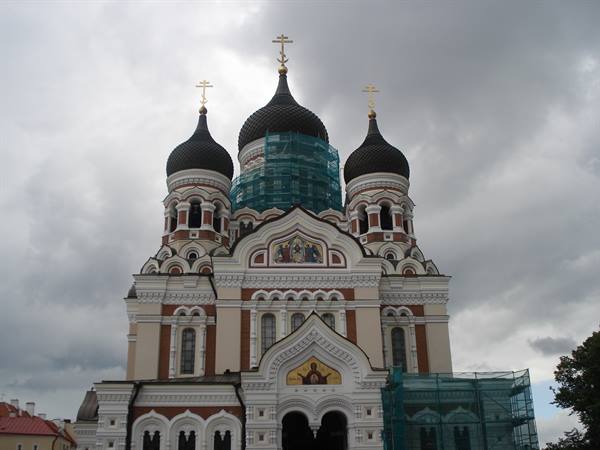 Alexander Nevsky Orthodox Cathedral in Tallinn, black domes under cloudy sky