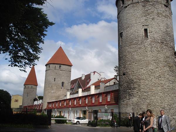 Medieval grey stone towers with red conical roofs, Tallinn