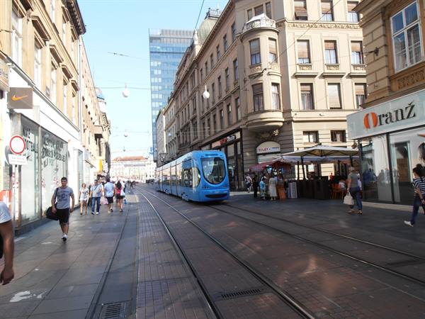 the shopping street with the blue tram of the excellent network 