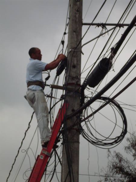 Technician busy repairing electrical wires
