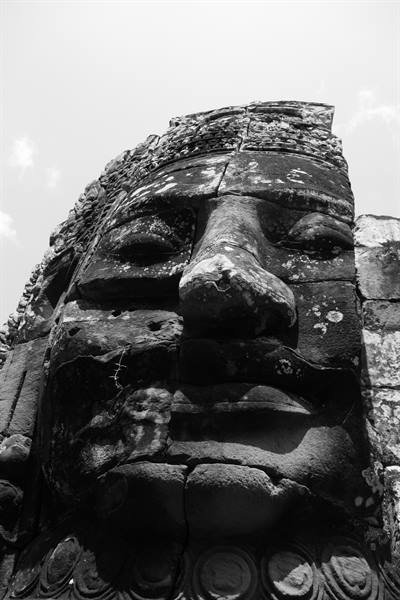 Carved stone face at Bayon temple, Siem Reap, black and white