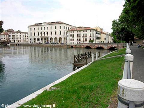 Sile river with colorful buildings and stone bridge, Treviso