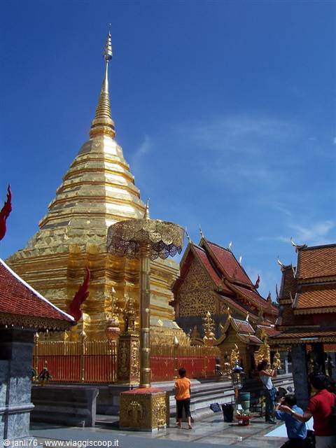 Wat Phra That Doi Suthep, visitors beneath the golden chedi and gilded umbrella