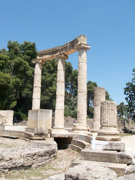 Ionic columns of the Philippeion at Olympia under blue sky