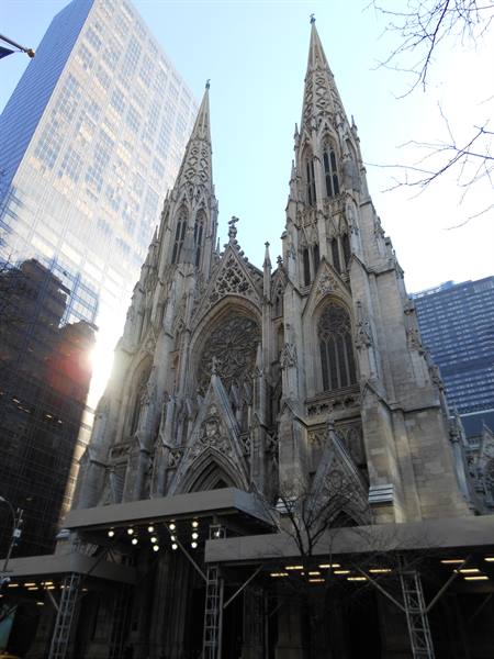 Gothic stone spires of St. Patrick's Cathedral rising among Manhattan skyscrapers