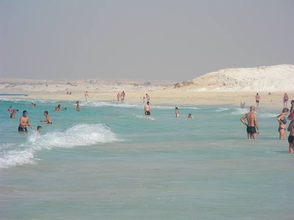 WHITE DUNES AND EMERALD GREEN SEA