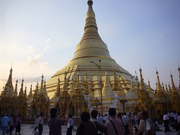 Visitors on the plaza of the great golden Shwedagon pagoda stupa in Yangon