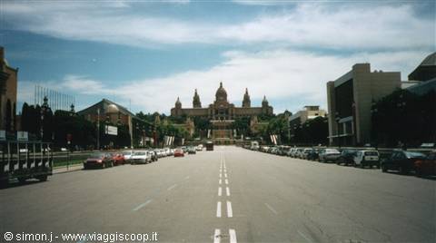 The Mnac palace on Montjuïc seen from the avenue, parked cars and cloudy sky