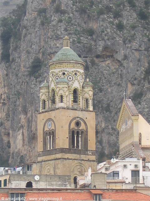 Amalfi's majolica-tiled bell tower against the rocky cliff