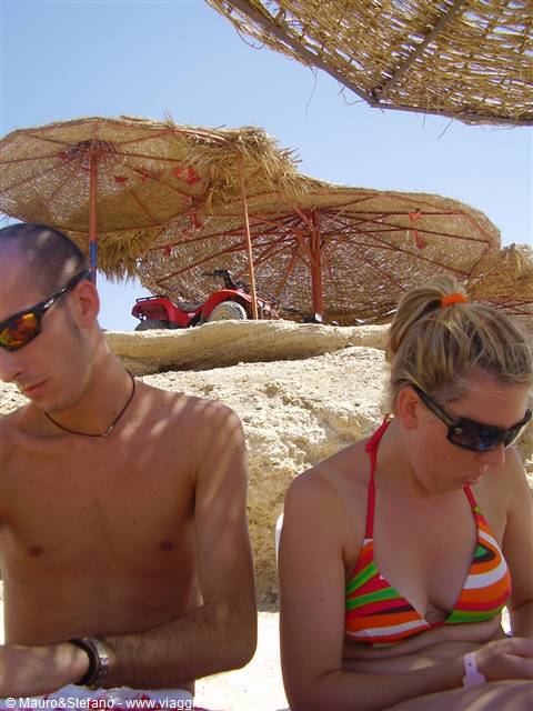 Stefano and Mara under the beach umbrella