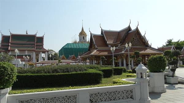 Thai pavilions with tiered roofs and Loha Prasat spire at Wat Ratchanatdaram, Bangkok