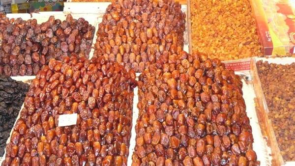 Piles of dates and dried fruit on a market stall