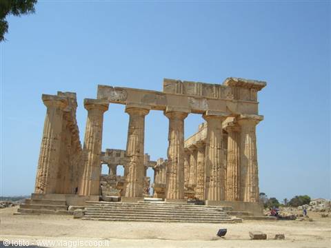 Doric temple ruins at Selinunte, sandstone columns in bright midday sun