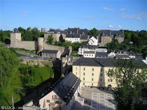 Old stone houses and medieval walls under blue sky, Luxembourg City