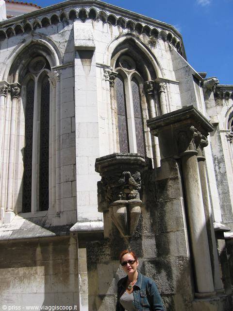 Woman standing before the Gothic ruins of Convento do Carmo, Lisbon