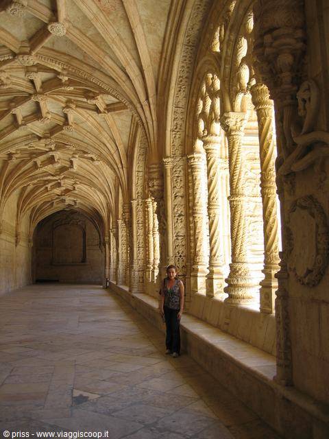 Woman in the Manueline cloister of the Jerónimos Monastery, Lisbon