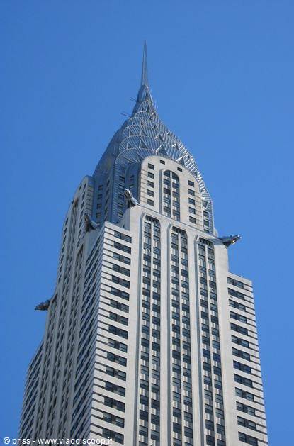 Stainless steel spire of the Chrysler Building against blue sky, New York
