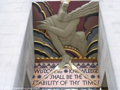 Golden art deco 'Wisdom' stone relief at Rockefeller Center, New York