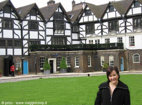 Smiling woman in front of the Queen's House at the Tower of London
