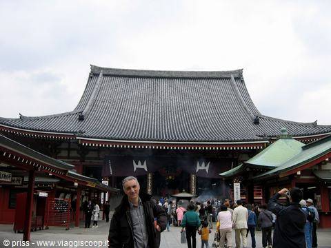 Visitors and incense smoke in front of Sensō-ji temple main hall