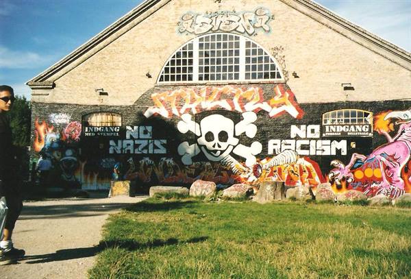 Antifascist skull mural on brick warehouse, Freetown Christiania, Copenhagen