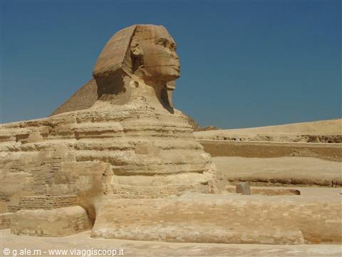 The Great Sphinx of Giza, ochre limestone, under a blue sky