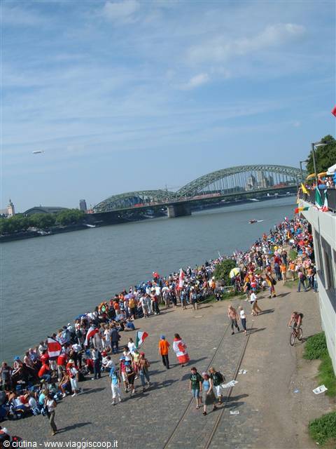 Crowd along the Rhine beneath the Hohenzollern Bridge in Cologne