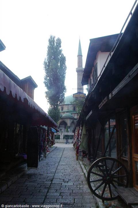 Cobbled lane in Bascarsija, Sarajevo, with mosque and minaret in background