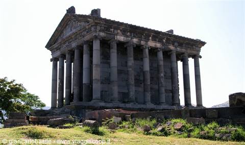 Hellenistic basalt temple with columns at Garni under a blue sky
