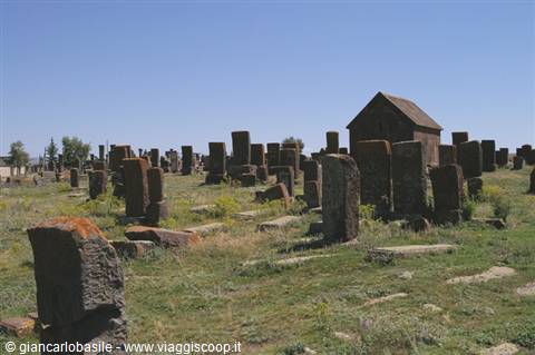 Noratus medieval cemetery, stone khachkar cross-slabs standing among the grass